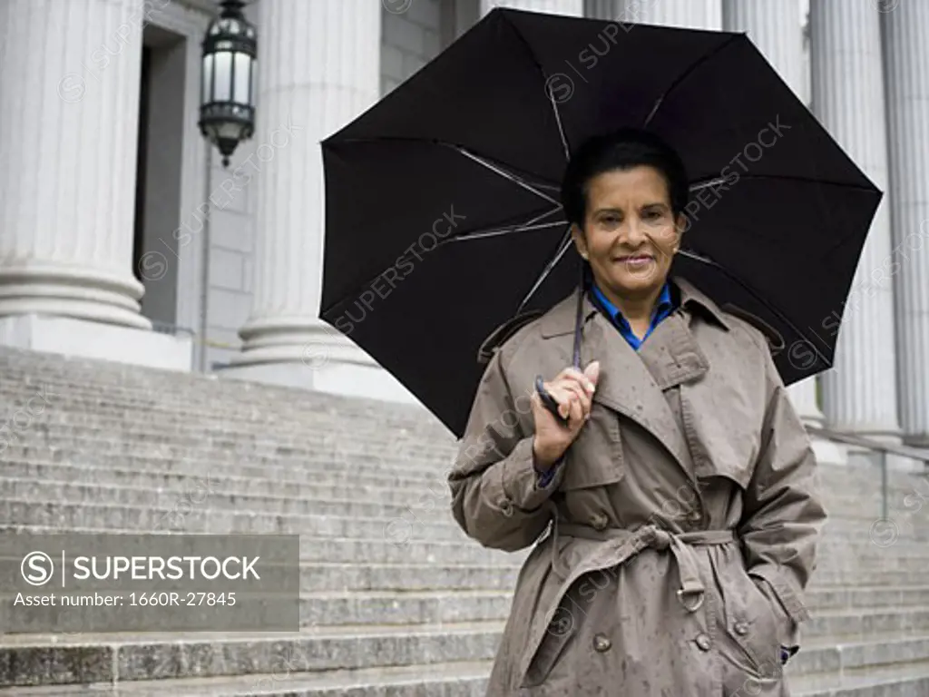 Portrait of a senior woman holding an umbrella