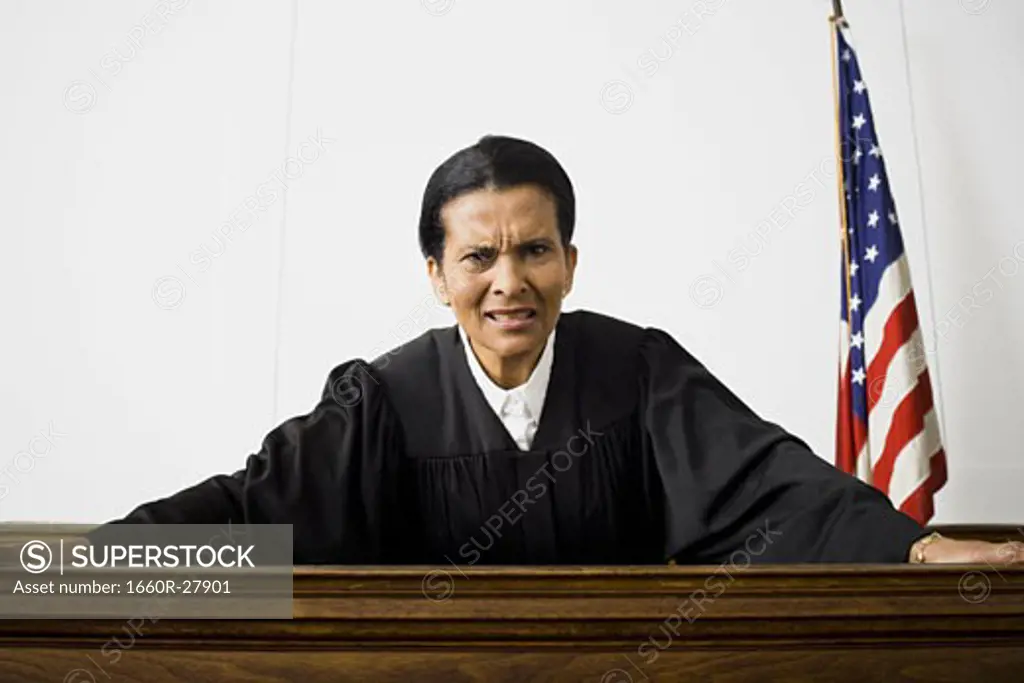 Portrait of a female judge holding a gavel