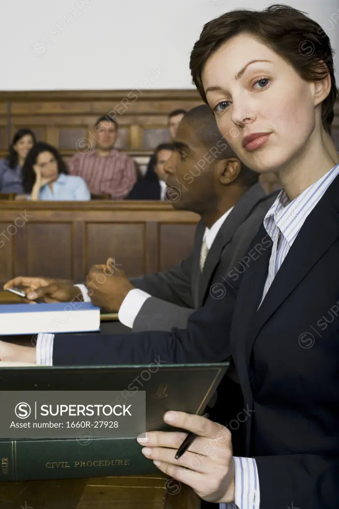 Portrait of a female lawyer sitting in a courtroom