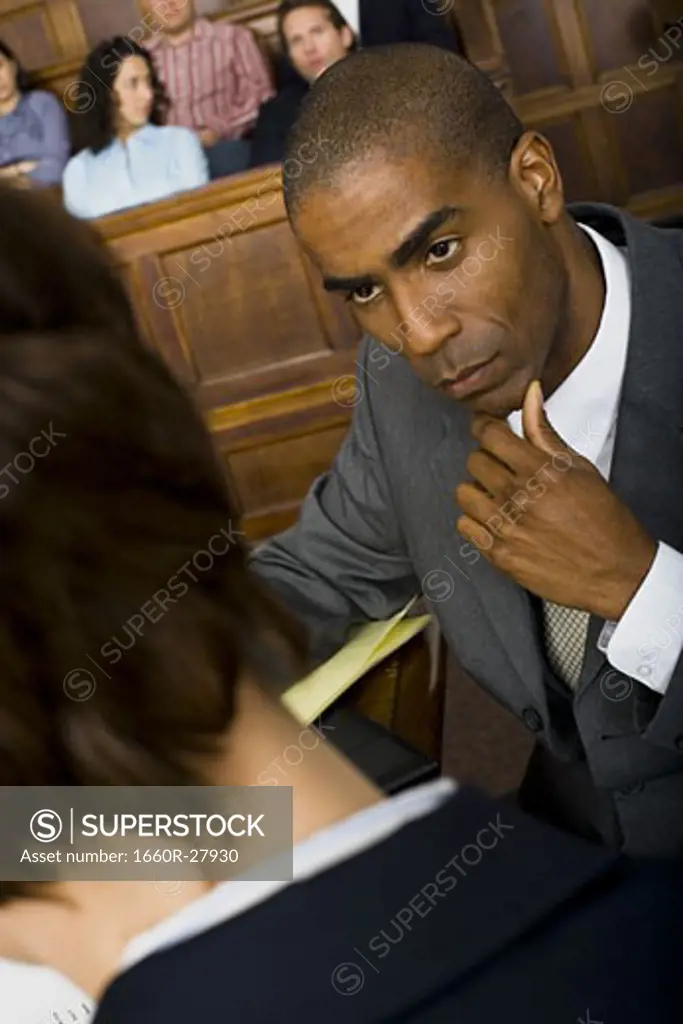 High angle view of a male lawyer in a courtroom during a trial