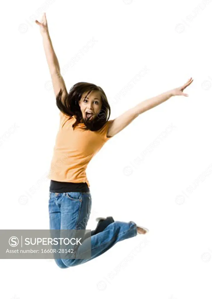 Portrait of a teenage girl jumping