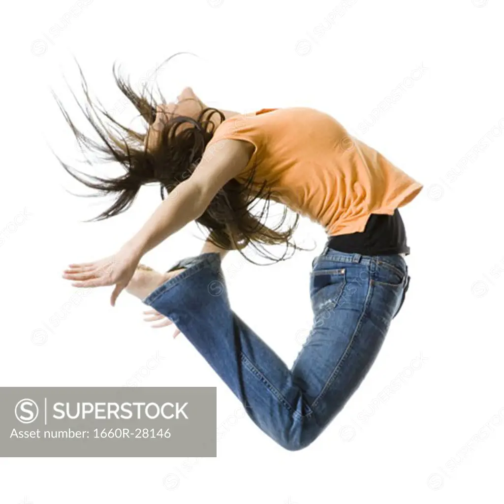 Portrait of a teenage girl jumping