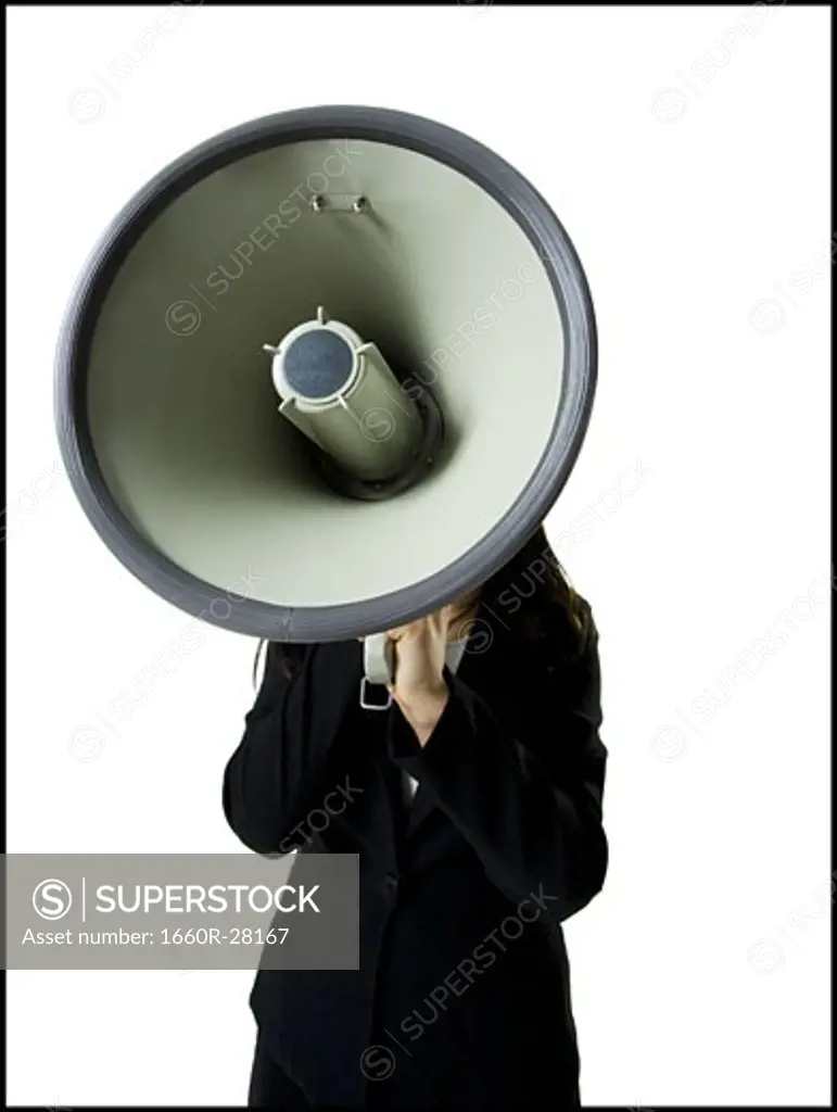 Close-up of a teenage girl holding a megaphone
