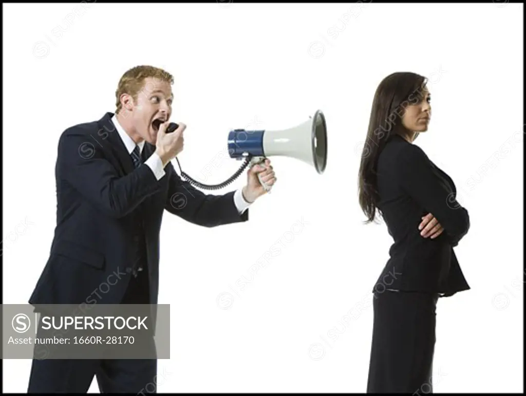 Profile of a businessman shouting into a megaphone with a teenage girl back