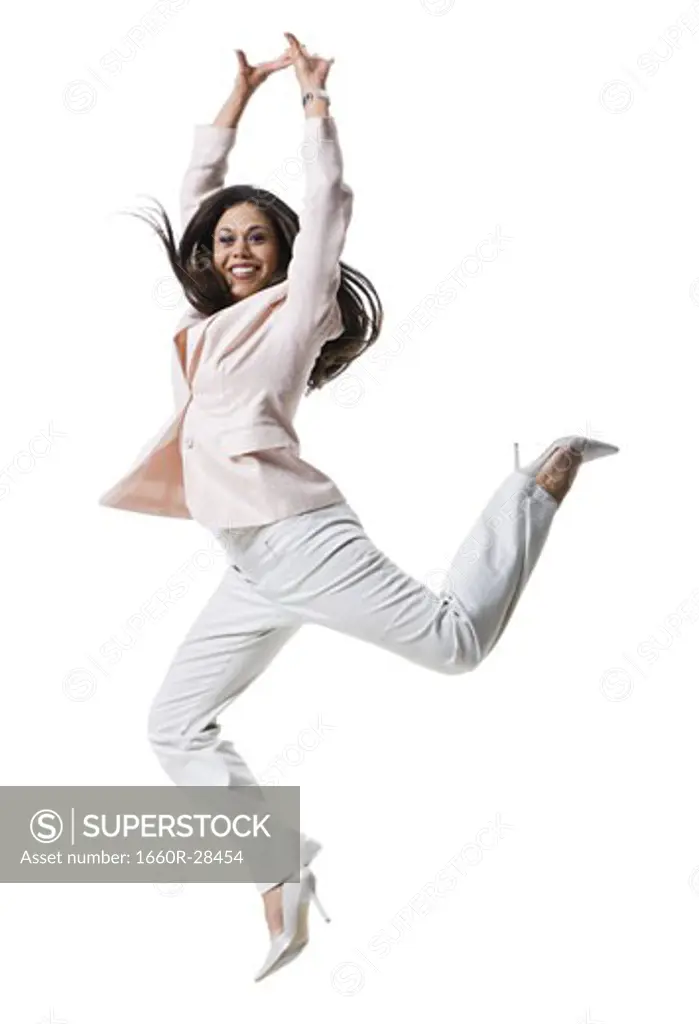 Portrait of a young woman jumping