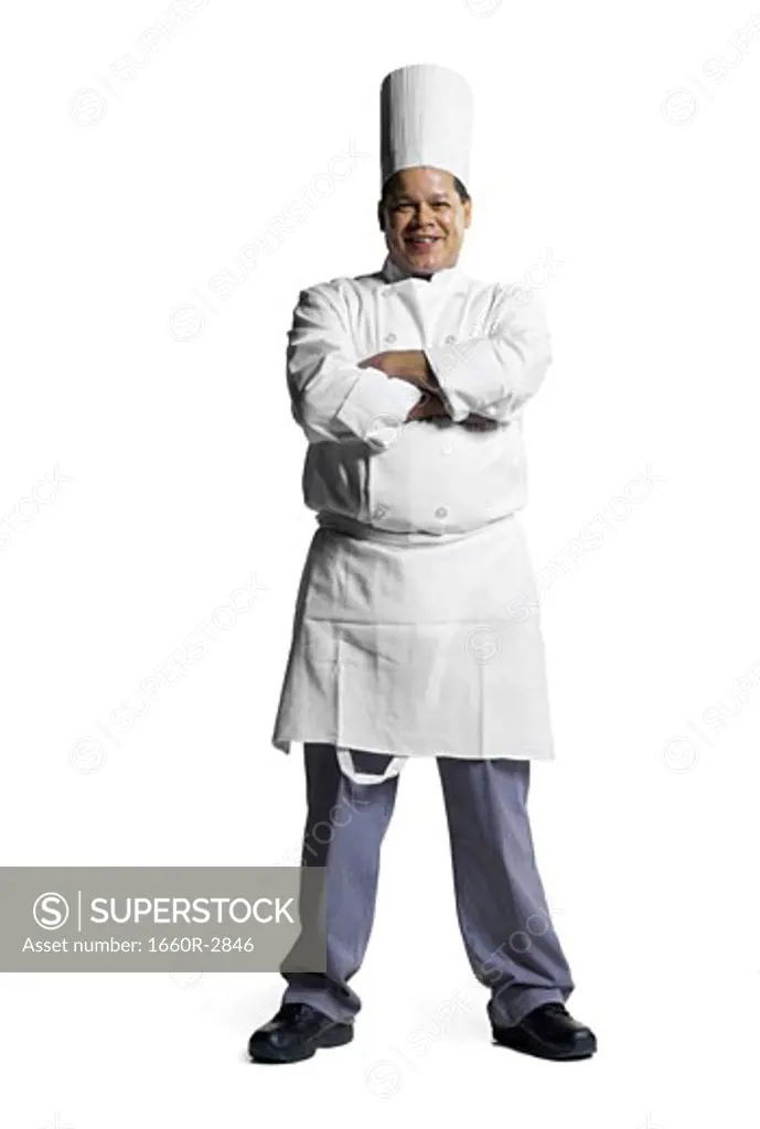 Portrait of a male chef standing with his arms folded