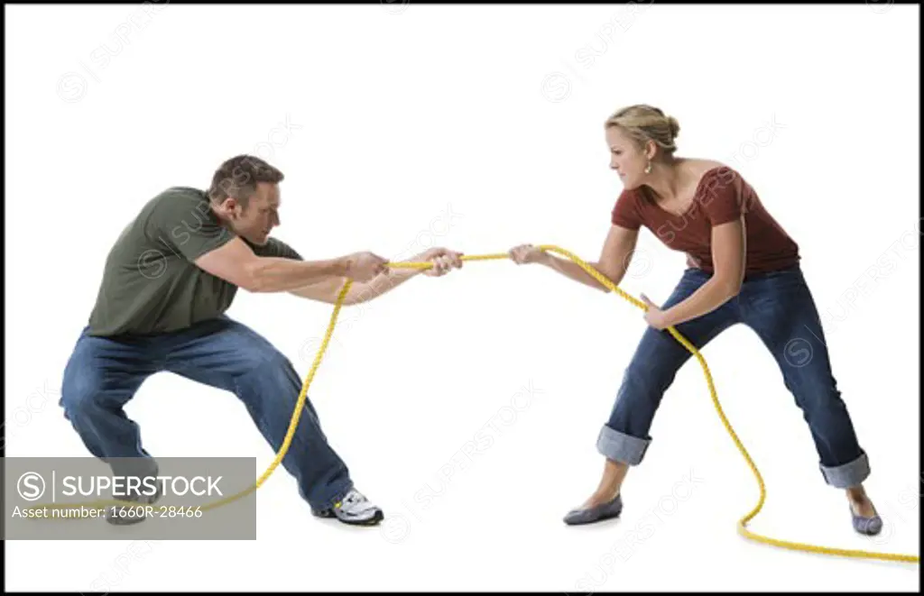Young couple playing tug-of-war