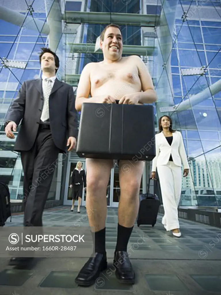 Low angle view of a naked man holding a briefcase