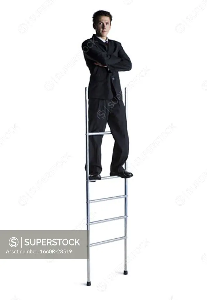 Businessman standing on corporate ladder