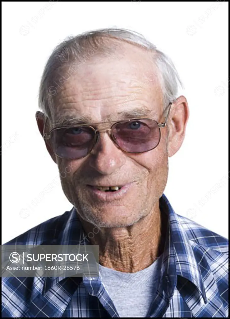 Older man in plaid shirt wearing sunglasses