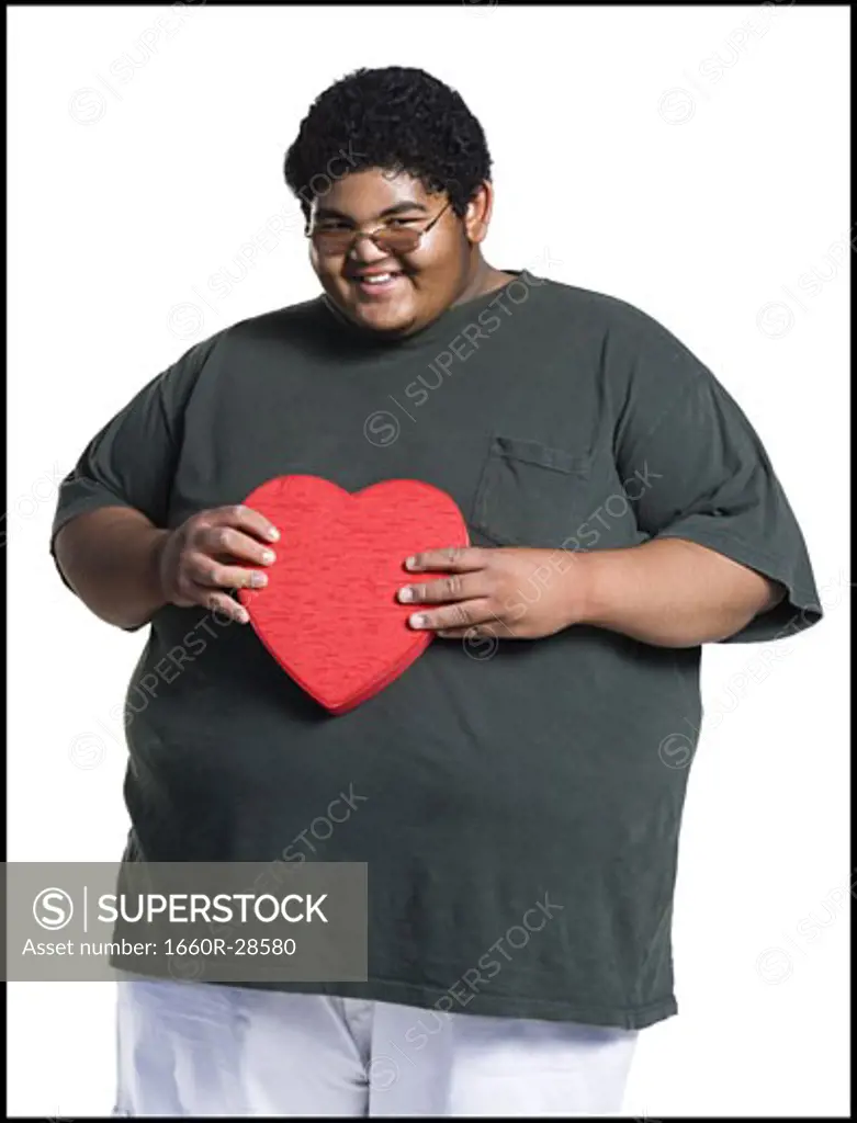 Heavyset young man with valentine box