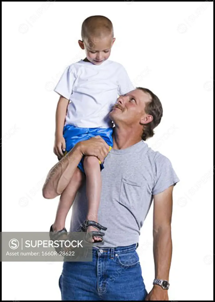 Father with son sitting on shoulder