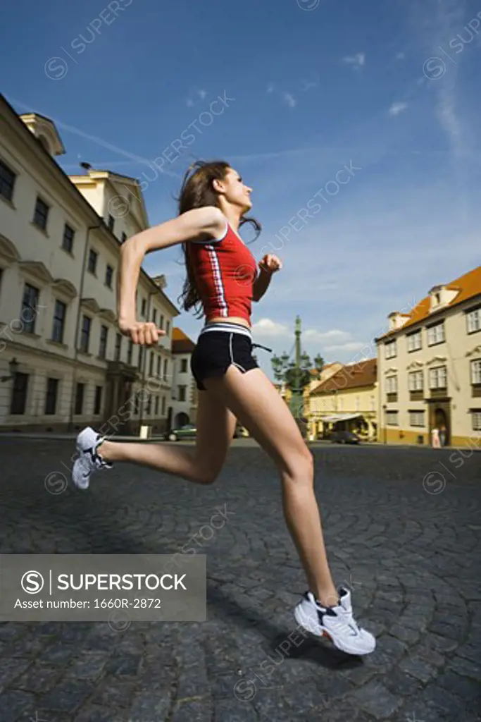 Profile of a young woman jogging