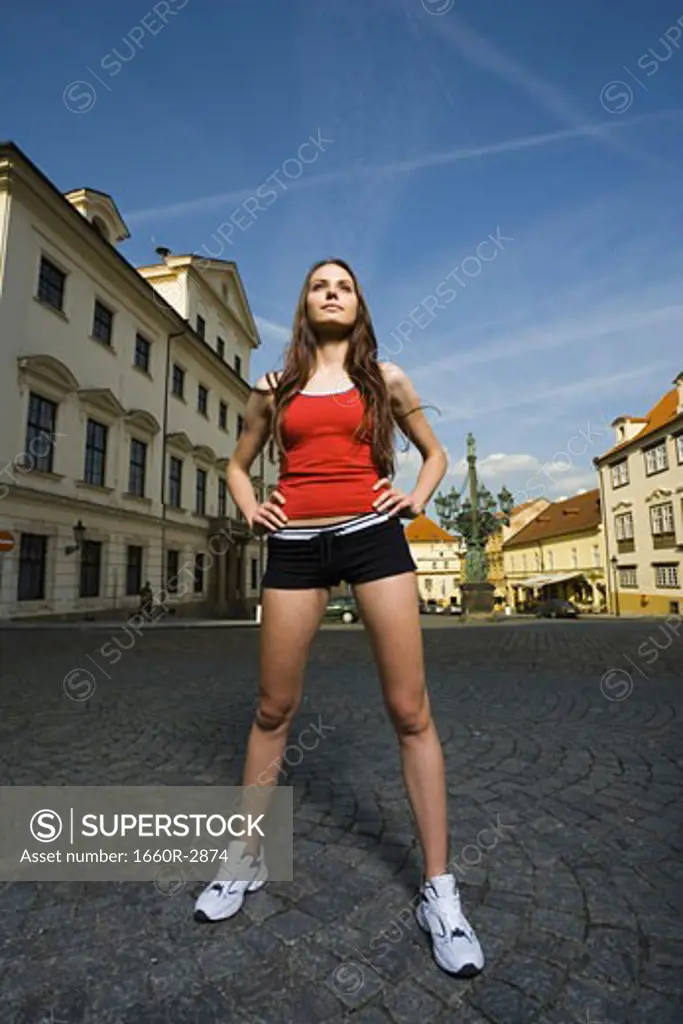 Low angle view of a young woman standing