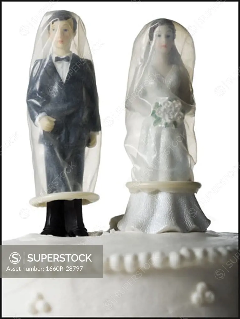 Wedding cake visual metaphor with figurine cake toppers