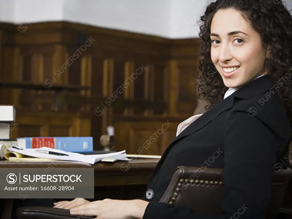 Female lawyer smiling in courtroom