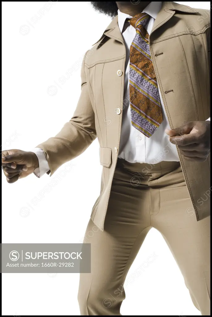 Man with an afro in beige suit