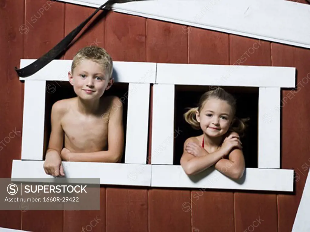 Boy and girl in a playhouse