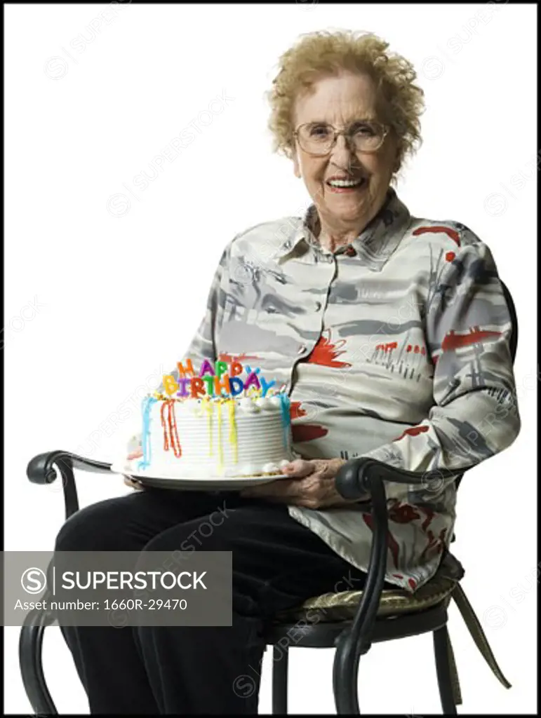 Elderly woman on her birthday with cake