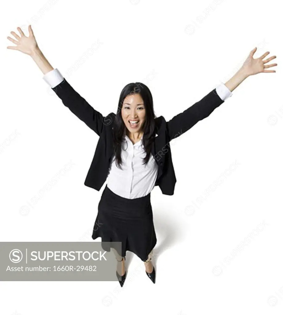 Businesswoman with arms up
