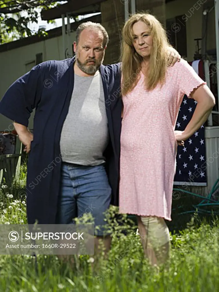 Overweight couple in a trailer park