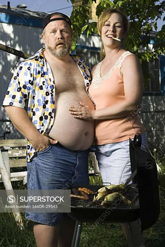 Overweight couple in a trailer park