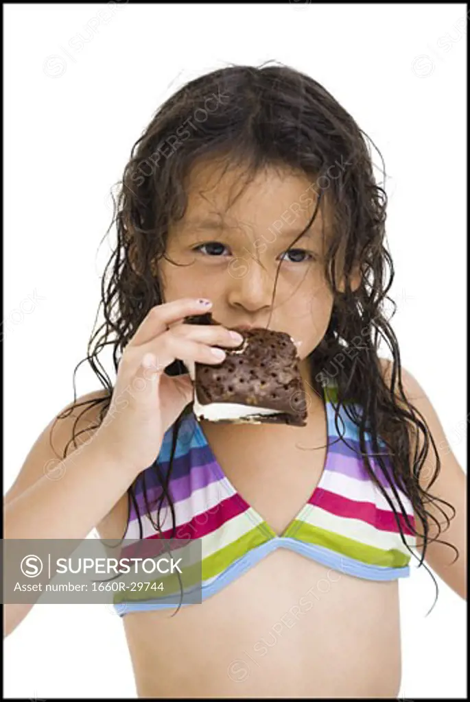 Young girl eating ice cream snack