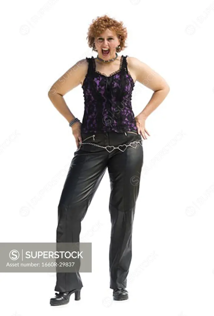 Smiling woman with red hair in leather pants