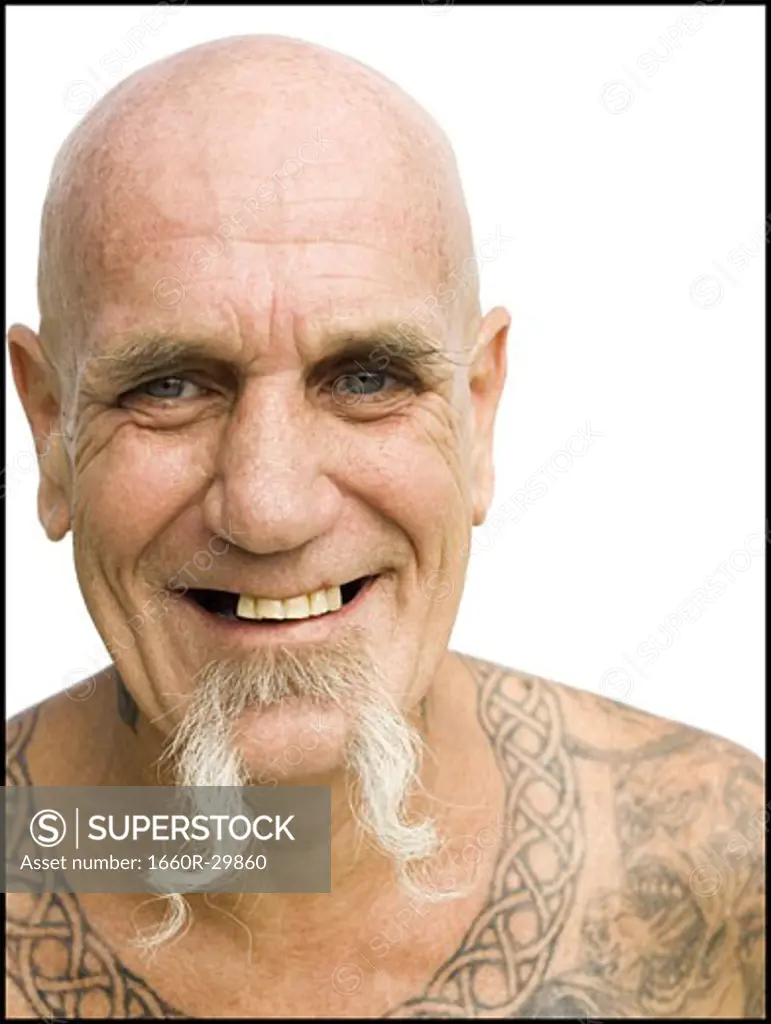 Heavily tattooed man smiling