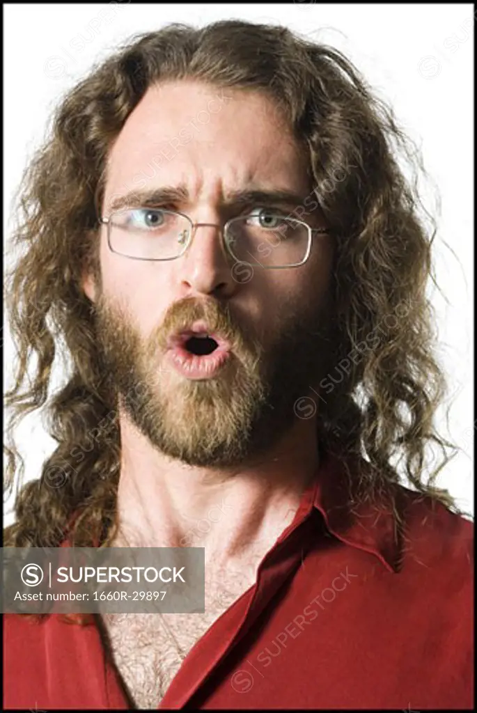 Surprised man with long hair and beard