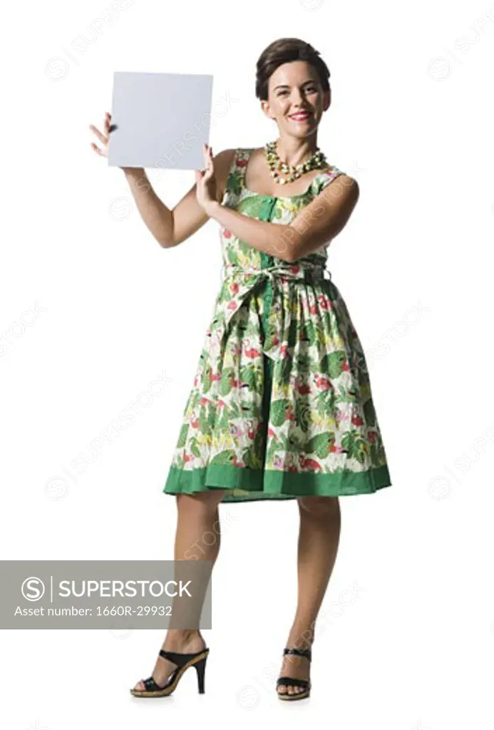 Woman in floral dress holding a blank sign