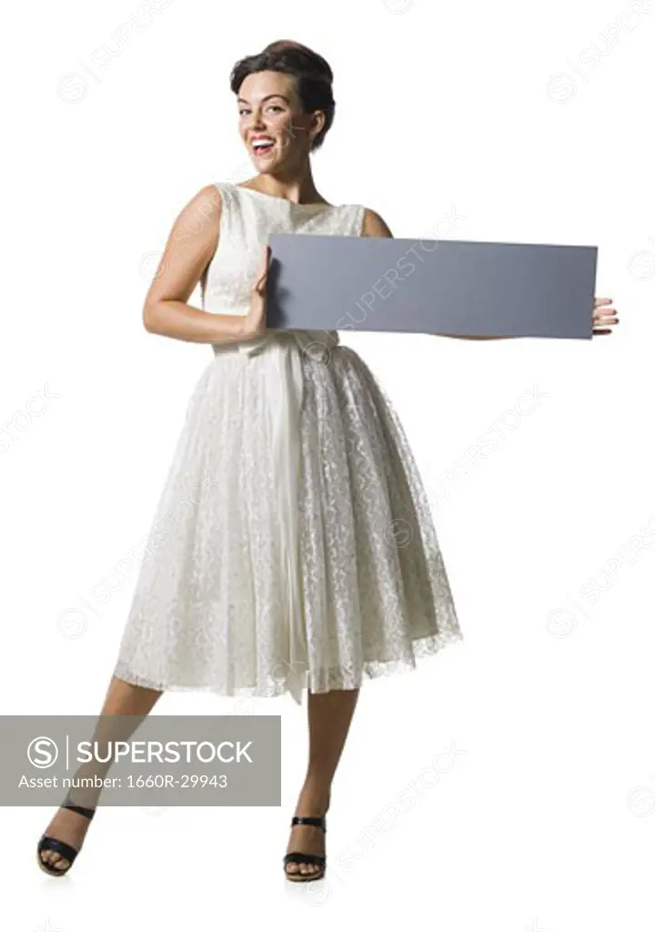 Woman in white dress holding a blank sign