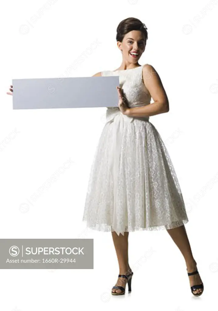 Woman in white dress holding a blank sign