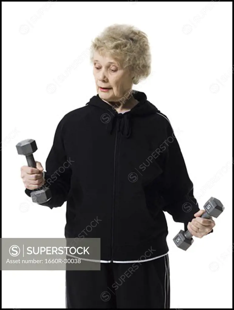 Older woman doing dumbbell exercises