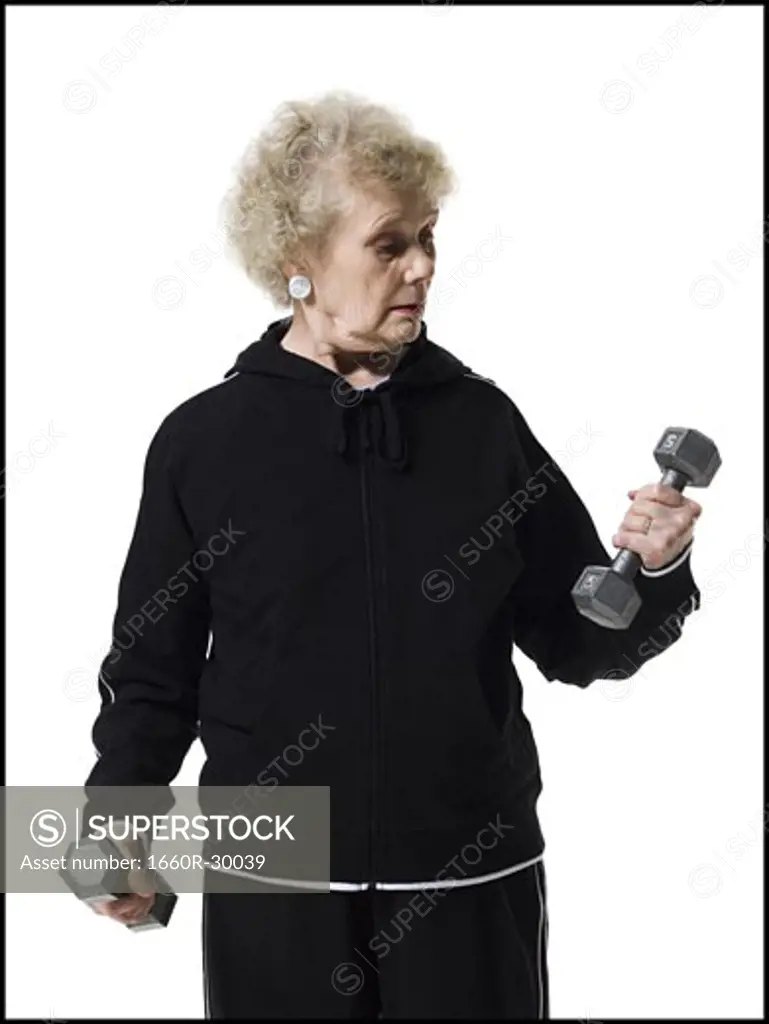 Older woman doing dumbbell exercises