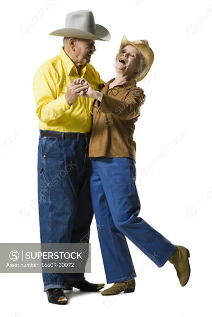Older couple in western clothing dancing