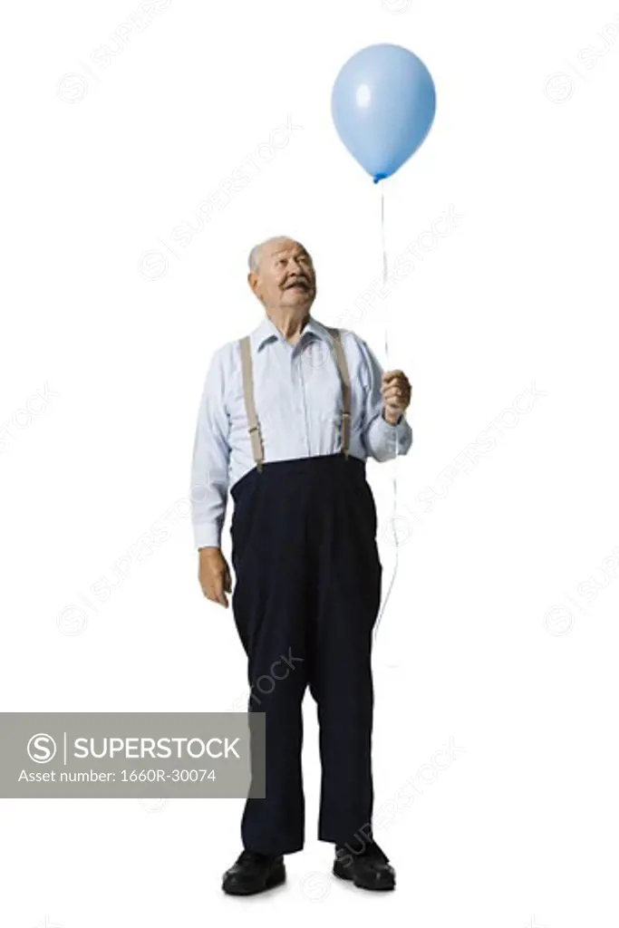 Older man holding balloon