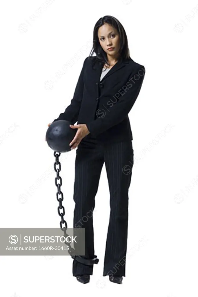Businesswoman shackled to ball and chain