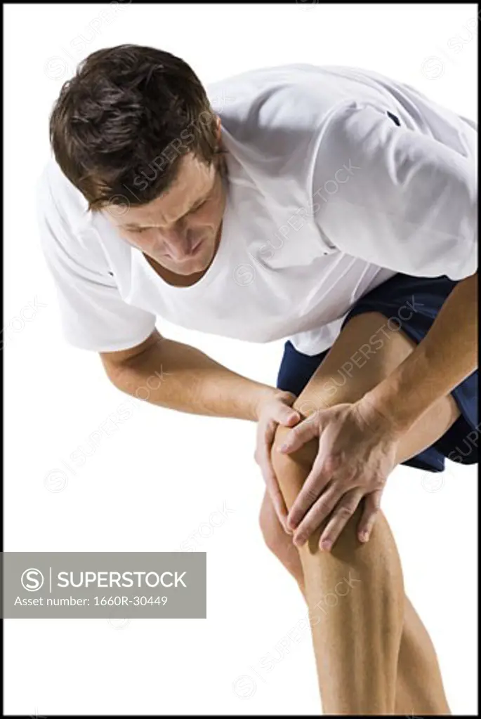 Man wrapping knee in a bandage