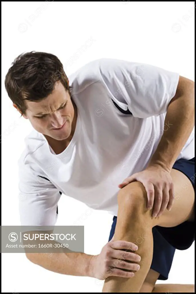 Man massaging a sore knee