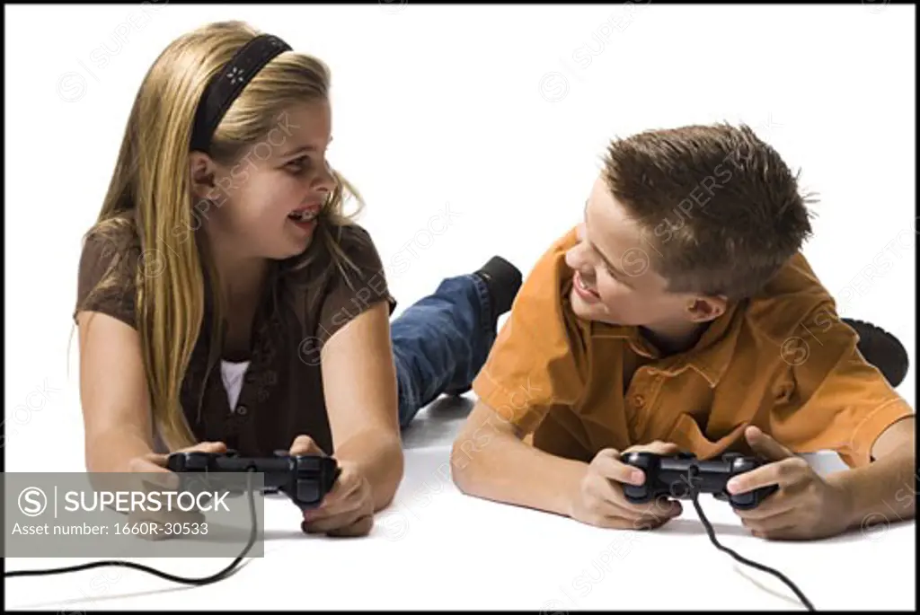 Brother and sister playing a video game