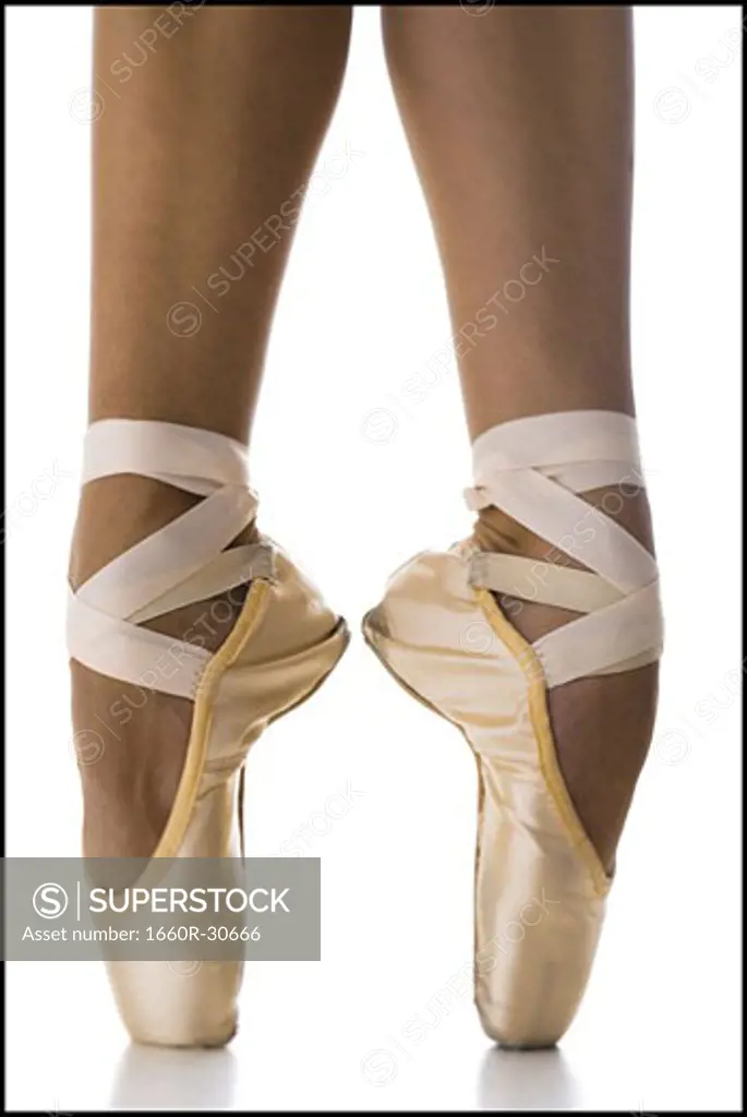 Close-up of feet wearing ballet slippers