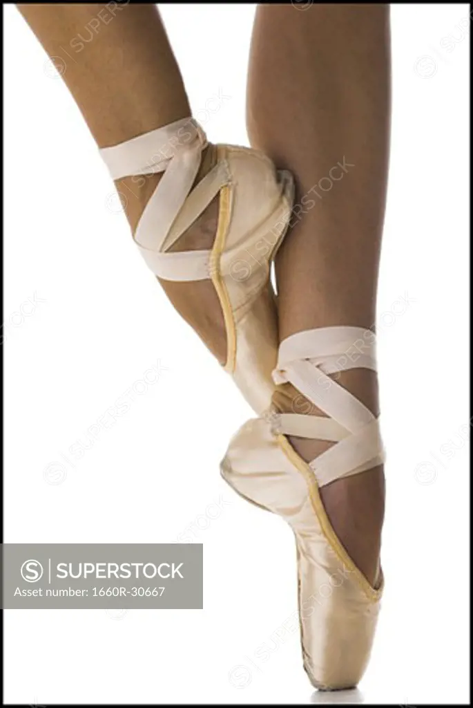 Close-up of feet wearing ballet slippers