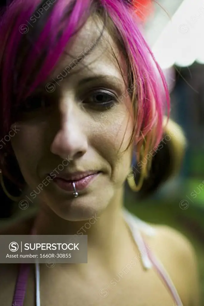 Female punk with dyed pink hair