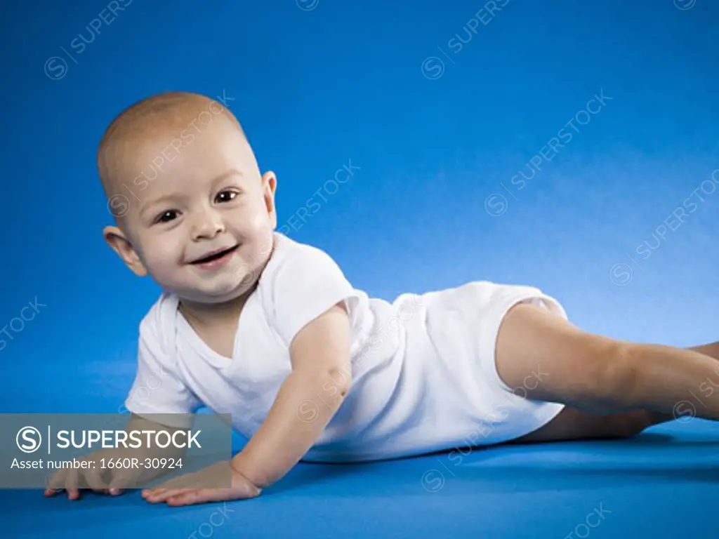 Baby on belly smiling