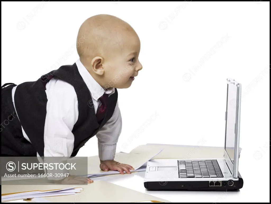 Baby Boy in suit with laptop