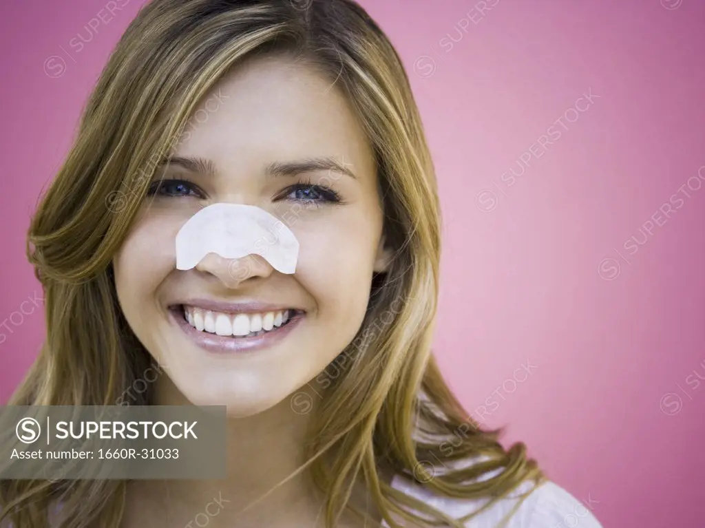 Woman with cleansing strip on nose