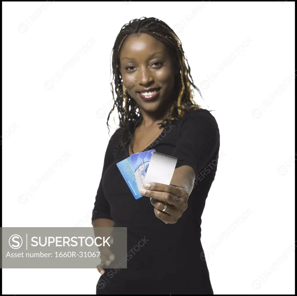 Woman holding bank card smiling