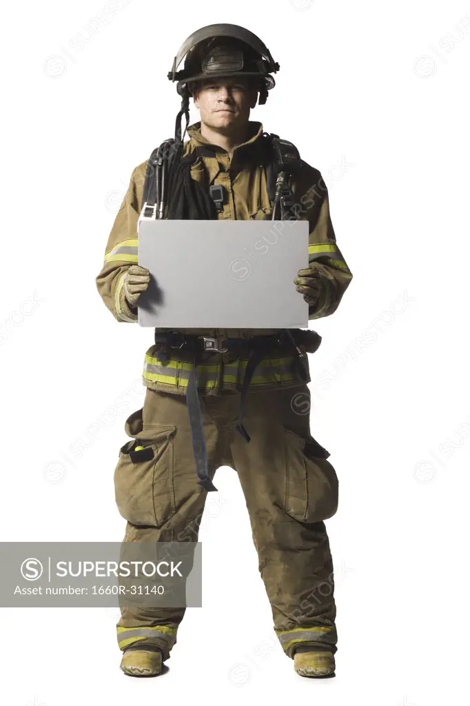 Portrait of a firefighter with blank sign