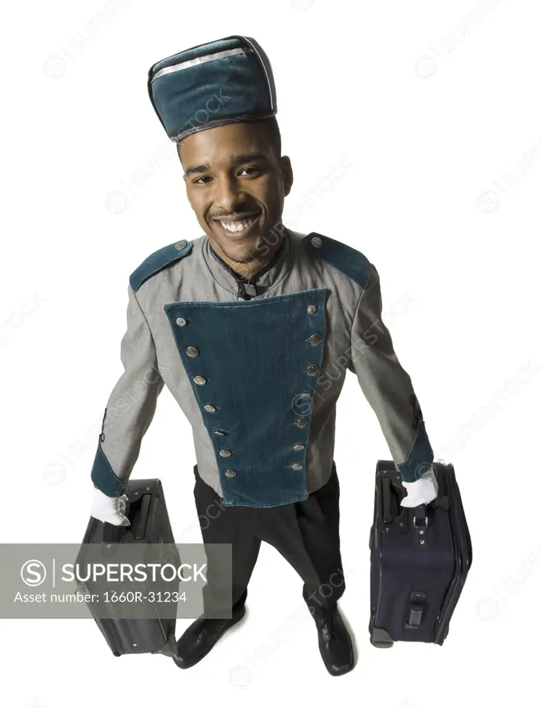 Bellboy with luggage smiling